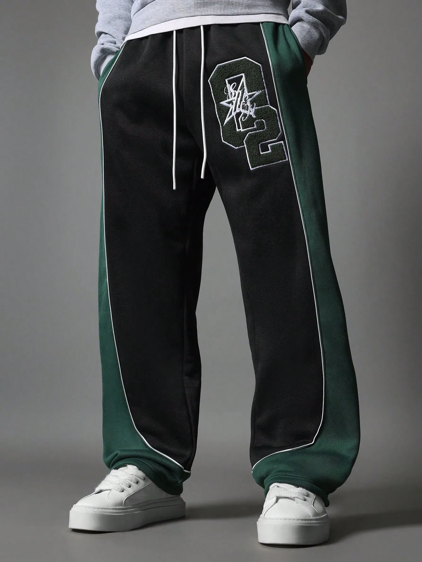 Wide Fit Drop Crotch Contrast Panel Sweatpants With Piping & Applique Badge Towelling